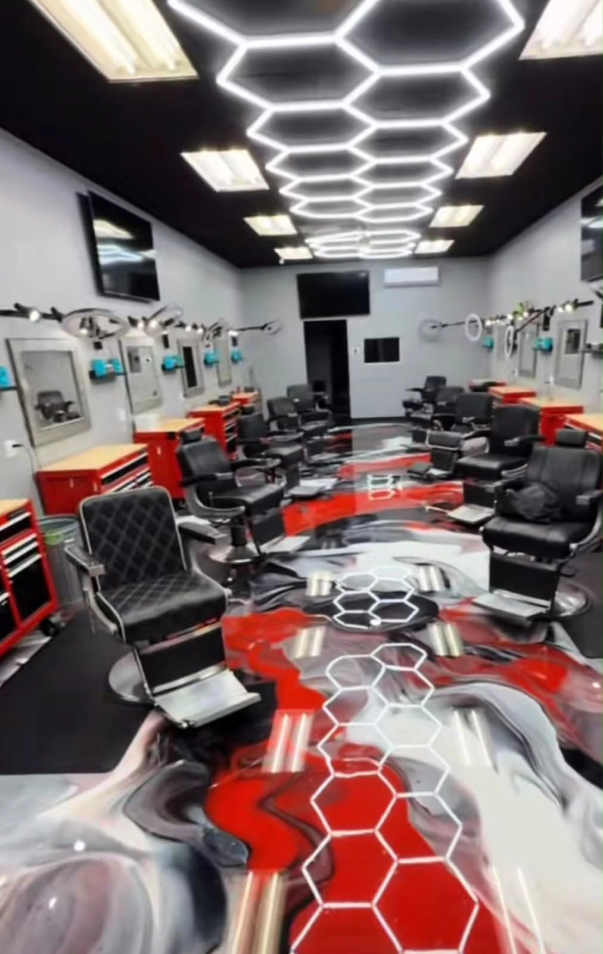 A barbershop with a red, silver and black metallic resin floor